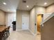 Hallway view of an elevator and dining area at 7667 Recife Dr, Kissimmee, FL 34747