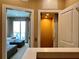 Hallway with bedroom entrance and elevator access for convenience offers a seamless transition between living spaces at 7667 Recife Dr, Kissimmee, FL 34747