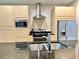 Modern kitchen featuring stainless steel appliances, wood cabinets, and granite countertops at 7667 Recife Dr, Kissimmee, FL 34747
