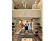 Spacious living room features a loft, modern lighting, and flows into a well-equipped kitchen at 7667 Recife Dr, Kissimmee, FL 34747