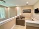 Comfortable loft area is great for relaxing and entertaining with a contemporary design at 7667 Recife Dr, Kissimmee, FL 34747