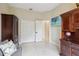Bright bedroom features white tile floors and a television screen on the wall at 802 Kaywood Dr, Orlando, FL 32825