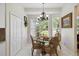 Cozy breakfast nook features a glass table, ornate chairs, and a large window with natural light at 802 Kaywood Dr, Orlando, FL 32825