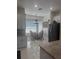 Eat-in dining space with modern lighting, white cabinets, granite countertops, and black stainless steel appliances at 802 Kaywood Dr, Orlando, FL 32825