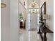 Bright entryway with tile floors, a decorative chandelier, and a stylish console table at 802 Kaywood Dr, Orlando, FL 32825