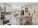 Bright kitchen featuring stainless steel appliances, marble countertops, and a breakfast nook with a view at 802 Kaywood Dr, Orlando, FL 32825
