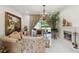 Cozy living room with a fireplace, large windows, and elegant furnishings at 802 Kaywood Dr, Orlando, FL 32825