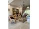 Inviting living room with tile floors, chandelier, comfortable seating, and access to outdoor space at 802 Kaywood Dr, Orlando, FL 32825