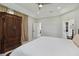 The main bedroom features a tray ceiling, neutral tones, and a glimpse into the walk in closet at 802 Kaywood Dr, Orlando, FL 32825