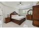 Spacious main bedroom with elegant dark wood furnishings and neutral decor offers comfort and style at 802 Kaywood Dr, Orlando, FL 32825