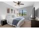 Comfortable bedroom with a large window and a ceiling fan at 8312 Prestbury Dr, Orlando, FL 32832