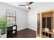 Inviting bedroom with a modern sauna, dark wood floors, and natural light from the window at 8312 Prestbury Dr, Orlando, FL 32832