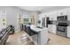 Open concept kitchen boasts stainless appliances, a kitchen island, and a breakfast nook at 8312 Prestbury Dr, Orlando, FL 32832