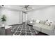 Comfortable living room with sofa, area rug, ceiling fan and neutral color palette at 8312 Prestbury Dr, Orlando, FL 32832