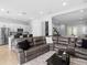 Spacious living room boasts recessed lighting and open access to the kitchen and dining areas at 8312 Prestbury Dr, Orlando, FL 32832