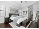 Well-lit main bedroom featuring tray ceilings, dark wood floors, and neutral decor at 8312 Prestbury Dr, Orlando, FL 32832