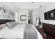 Well-lit main bedroom featuring tray ceilings, dark wood floors, and neutral decor at 8312 Prestbury Dr, Orlando, FL 32832