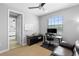 Bright office with desk, comfortable chair, and ample natural light; doorway to bathroom at 8312 Prestbury Dr, Orlando, FL 32832