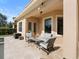 Inviting covered patio features comfortable seating area for relaxing and entertaining, right off the pool at 8312 Prestbury Dr, Orlando, FL 32832