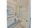 Well-lit bathroom with modern vanity, shower-tub combo, and neutral color scheme at 944 Park Terrace Cir, Kissimmee, FL 34746