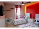Bedroom with two twin beds, a desk, a ceiling fan and fun cartoon themed decor at 944 Park Terrace Cir, Kissimmee, FL 34746