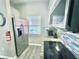 Well-equipped kitchen featuring stainless steel appliances, blue backsplash and granite countertop at 944 Park Terrace Cir, Kissimmee, FL 34746
