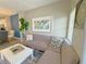 Cozy living room with a comfortable gray sofa, stylish pillows, and an artistic wall decoration above the sofa at 944 Park Terrace Cir, Kissimmee, FL 34746