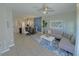 Open-concept living and dining area with modern decor, light wood floors, and a stylish blue accent wall at 944 Park Terrace Cir, Kissimmee, FL 34746