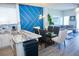 Open concept featuring a kitchen with island, dining table, and cozy living room area at 944 Park Terrace Cir, Kissimmee, FL 34746