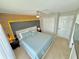 Main bedroom with a modern headboard, decorative lighting, a ceiling fan, and double closets at 944 Park Terrace Cir, Kissimmee, FL 34746