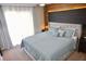 Modern main bedroom with a gray upholstered bed frame and light blue bedding at 944 Park Terrace Cir, Kissimmee, FL 34746