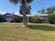 Single-story home featuring a blend of brick and siding, complemented by a well-maintained front yard at 977 E Normandy Blvd, Deltona, FL 32725