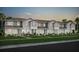 Charming townhome exterior featuring landscaped lawns, modern design, and a welcoming facade at 10160 Hadley St, Orlando, FL 32829
