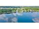 Stunning aerial view of a waterfront property with a private dock and lush green surroundings at 10352 Burris Ct, Orlando, FL 32836