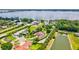 Aerial view of the luxurious neighborhood by the water showcasing lush landscaping and beautiful homes at 10352 Burris Ct, Orlando, FL 32836