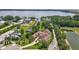 Stunning lakefront home with lush landscaping, a private dock, and a terracotta roof at 10352 Burris Ct, Orlando, FL 32836
