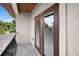 A balcony view featuring double glass doors and stucco at 10352 Burris Ct, Orlando, FL 32836