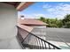 This balcony has black metal railings and a view of the roof at 10352 Burris Ct, Orlando, FL 32836