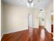 This bedroom has hardwood floors and two doors at 10352 Burris Ct, Orlando, FL 32836