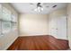 This bedroom has a ceiling fan, and beautiful wood floors at 10352 Burris Ct, Orlando, FL 32836