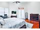 The main bedroom features a tray ceiling, hardwood floors, and plenty of space for relaxing and unwinding at 10352 Burris Ct, Orlando, FL 32836