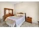Inviting bedroom with traditional furniture and a decorative comforter set at 10352 Burris Ct, Orlando, FL 32836