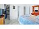 Bedroom featuring a comfortable bed, neutral colors, and closet space at 10352 Burris Ct, Orlando, FL 32836