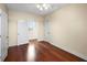 This cozy bedroom with shining hard wood floors provides ample lighting and closet space at 10352 Burris Ct, Orlando, FL 32836