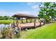 Well-maintained boat dock with a covered structure, providing convenient access to water activities at 10352 Burris Ct, Orlando, FL 32836