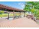 Private boat dock featuring a covered area, seating, and easy access to the water at 10352 Burris Ct, Orlando, FL 32836