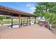 Private boathouse on the water featuring a boat lift and relaxing bench at 10352 Burris Ct, Orlando, FL 32836