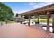 Private boathouse with boat lift, wood deck, and serene waterfront views at 10352 Burris Ct, Orlando, FL 32836