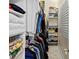 Organized walk-in closet with shelving, hanging rods, and ample storage space at 10352 Burris Ct, Orlando, FL 32836
