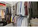 Walk-in closet with custom shelving and organization system for ample storage at 10352 Burris Ct, Orlando, FL 32836